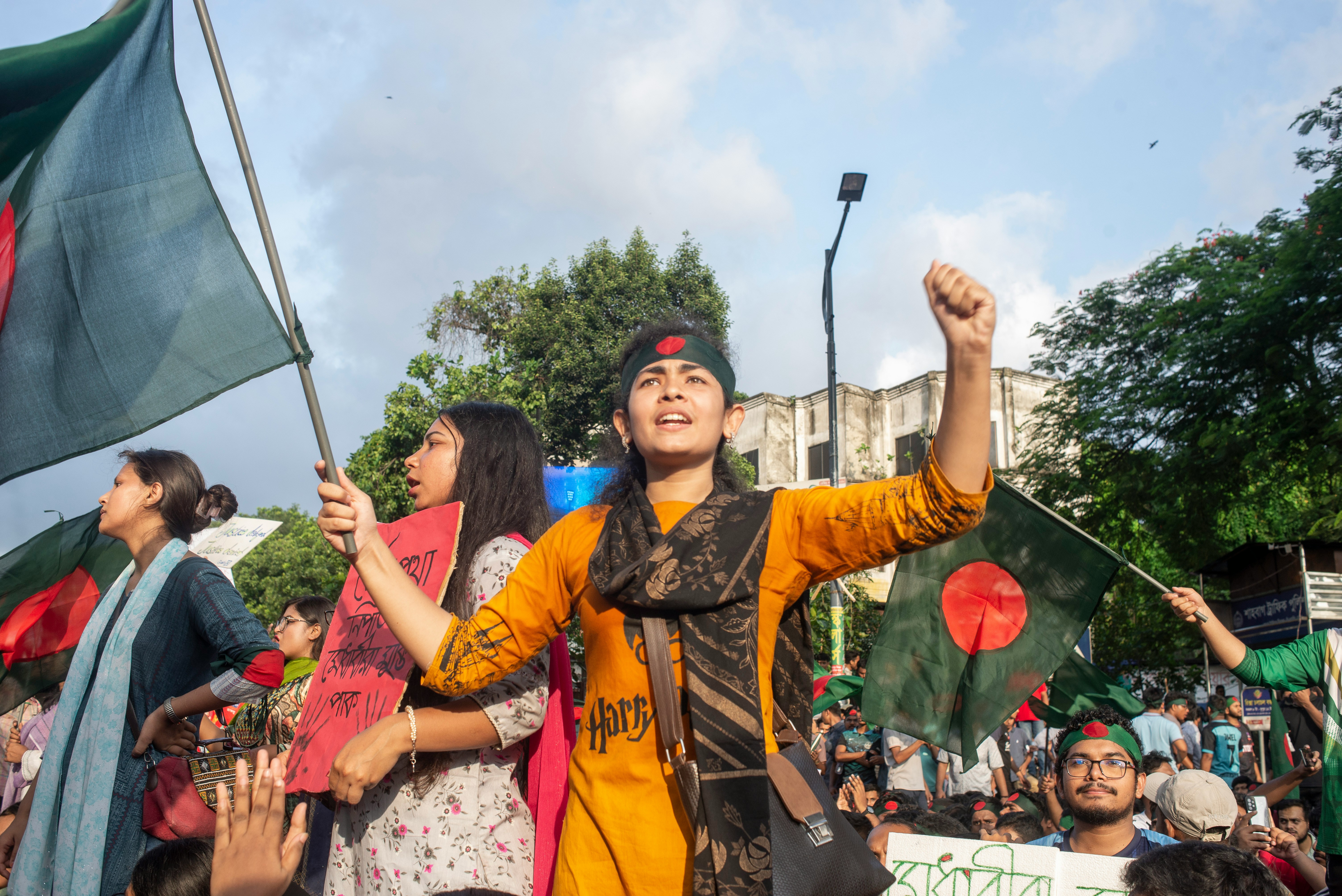 People in Bangladesh waving a flag in a demonstration